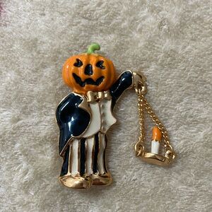 jack-o’-lantern with hanging candle